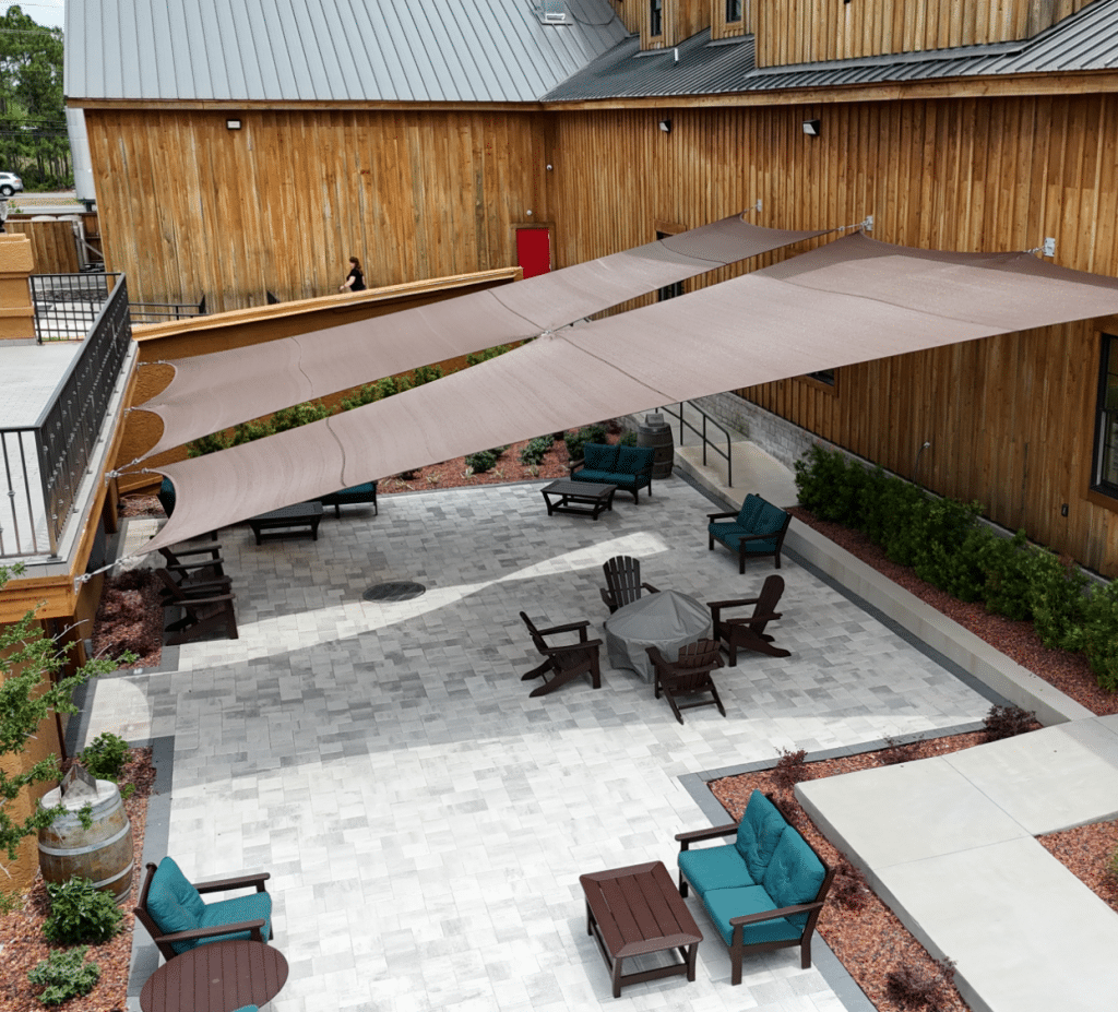 Newly installed shade sails on an outdoor patio by Emerald Coast Shade in Panama City at the Duplin Winery