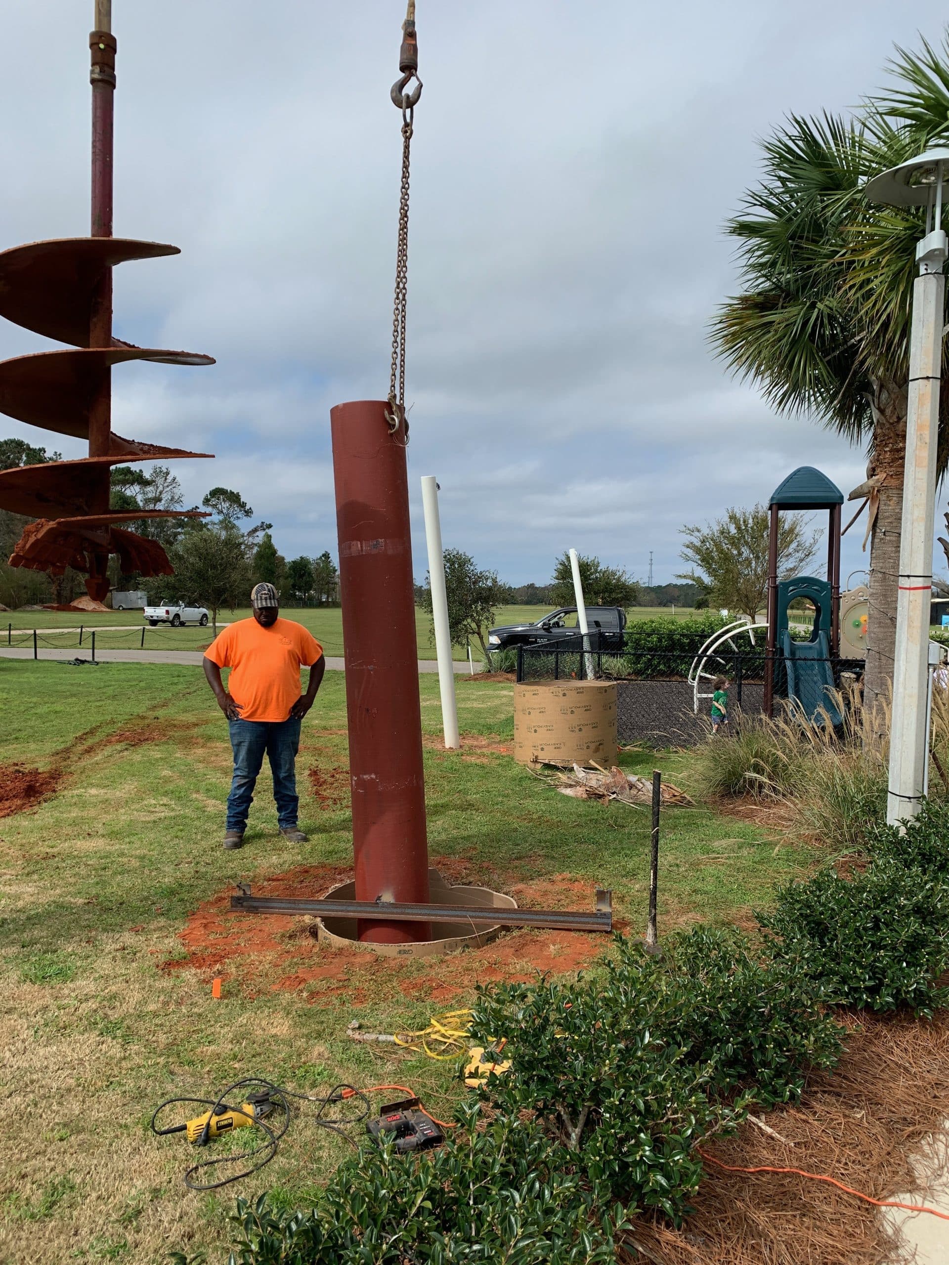 Emerald Coast Shade sail contractor installing shade poles for new shade structure at a park